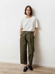 Classic trouser with a tapered bow leg and hidden zip-button fly. Feels like: Soft but structured canvas 100% Cotton Canvas | Hand wash ColdMade in Vancouver, Canada. Fit: Sara is 5'-6" | Waist: 24.5" | Hips: 35" she is wearing a Small and it is loose around her waist _______________________________________________________ Fit Guide*: XS: Waist: 26" Hips: 41" Rise: 11.5" Inseam: 24" S: Waist: 27" Hips: 42" Rise: 12" Inseam: 25" M: Waist: 29" Hips: 43" Rise: 12.5" Inseam: 26" L: Waist: 31" Hips: Bow Legged, Classic Trousers, Pleated Trousers, Vancouver Canada, Crop Tee, Look Cool, Trousers Women, Work Outfit, Vancouver