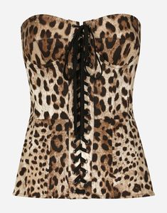 Leopard-print drill shaper corset with lacing: Sweetheart neckline Sleeveless Molded cups with underwiring Stretch drill lining Invisible zip and hook-and-eye fastening on the back The piece measures 37 cm from the center back on a size IT 40 The model is 175 cm tall and wears a size IT 40 Made in Italy The difference in the print placement that you may find on this product is a feature of Dolce & Gabbana’s “Handmade” pieces. A detail that makes every garment or accessory unique and exclusive. Black Pencil Skirt, Dolce E Gabbana, Bustier Top, Corset Style, Dolce & Gabbana, Corset Top, Printed Cotton, Fashion Clothes Women, Leopard Print