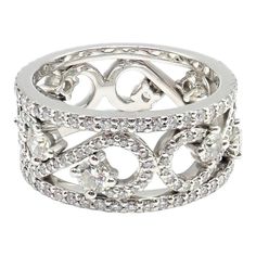 a white gold and diamond ring with hearts on the center, surrounded by smaller diamonds