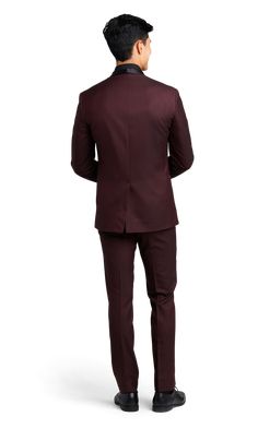 A slim burgundy tuxedo with one button and a shawl lapel. Elegant Fall Suit For Groom, Elegant Fall Suit For Grooms, Red Notch Lapel Three-piece Suit For Groom, Red Three-piece Suit With Notch Lapel For Groom, Elegant Burgundy Suits For Formal Occasions, Formal Fitted Three-piece Suit For Fall, Fall Formal Fitted Three-piece Suit, Fitted Three-piece Suit For Fall Formal Occasions, Elegant Burgundy Wedding Suits