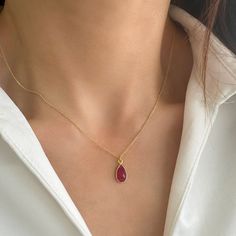 Tiny Ruby Necklace with a Genuine Ruby gemstone! This small Ruby Pendant Necklace is a July Birthstone Necklace! ✔️Genuine Red Ruby Necklace✔️ High-Quality  925 Sterling Silver ✔️ 24K Gold  Finish✔️ This Real Ruby necklace is great for wearing alone or for layering with other necklaces. It is the perfect gift for your girlfriend, sister, bridesmaids, or even yourself! Made by hand in Greece.   Moreover, RUBY is a really powerful crystal that promotes self-confidence and good fortune 👉A few word Red Gemstone Drop Necklace For Gift, Red Drop Necklace For Gift, Red Teardrop Gemstone Drop Necklace, Ruby Drop Necklace For Gift, Teardrop Crystal Clavicle Chain Necklace, Red Teardrop Gemstone Necklace, Gemstone Teardrop Pendant Drop Necklace, Ruby Gemstone Teardrop Pendant Necklace, Ruby Teardrop Pendant Necklace