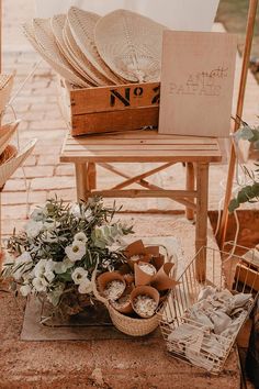 a table with baskets and flowers on it