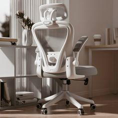 a white office chair sitting on top of a hard wood floor next to a window