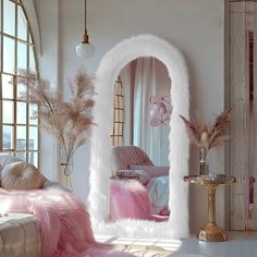 a living room filled with furniture and lots of pink fur on the floor next to a large window