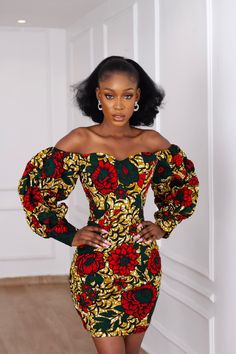 Time to turn it up for party season in this Beautiful African print Ankara Dress. The cut of this dress accentuates the body to a beautiful silhouette and has that perfect short length. Long Bubble sleeves that can be worn on or off-the-shoulder. Sweetheart neckline. Exaggerated sleeves with a cuff. Made with High quality 100% African Wax cotton Fully Lined Long zipper at the back for easy wear Made in Nigeria Models are wearing a US6/UK10 and US14/UK18 Dress Length approx. 37” CARE INSTRUCTIONS African Bodycon Dress, African Print Birthday Dress, Off Shoulder Ankara Dress Short, Sweetheart Neckline Ankara Dress, One Hand Ankara Dress Styles, African Cloth Dress Styles, Ankara Cute Dresses, Short Sleeve Ankara Dress, Offshoulder Ankara Dress With Elastic