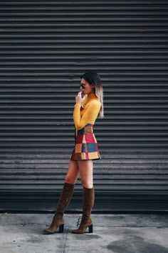 There are 4 tips to buy we wore what, blogger, skirt, top, shoes, saffron top, high waisted skirt, patch work skirt, suede boots, knee length suede boots, black aviators, orange top, turtleneck, turtleneck top, ombre hair, 70s style, shirt, yellow top, mini skirt, knee high boots, yellow, patchwork, pathwork, red yellow blue, brown, heel boots. Look Hippie Chic, Rock Outfit, Miniskirt Outfits, Outfit Trends, 1970s Fashion