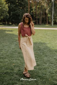 Wrap Linen Skirt: A boho style and minimal aesthetics. This skirt, adorned with a charming bow, is your ticket to effortless elegance. It's the go-to choice for fall looks for women, whether you're embracing casual chic or seeking the perfect party look. Perfect for work or a casual evening out outfit. IRIS is not just a trendy fall outfit; it's the ideal choice for fall weddings, date nights. Add this piece to your capsule wardrobe and enjoy free shipping on orders over $100! Summer Wrap Maxi Skirt With Lining, Summer Wrap Maxi Skirt With Lined Skirt, Relaxed Midi Wrap Skirt With Tie Waist, Summer Long Wrap Skirt With Tie Waist, Summer Asymmetrical Wrap Skirt With Tie Waist, Chic Linen Long Skirt, Chic Long Linen Skirt, Summer Midi Wrap Skirt, Spring Linen Maxi Skirt For Work