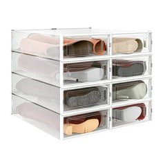 six clear bins filled with shoes on top of each other in front of a white background