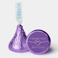 a purple foiled herss candy with a white ribbon on the top that says congratulations to kathy class of 2012