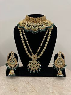 a necklace and earring set on display