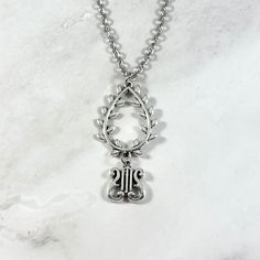 This beautiful chain necklace is the perfect way to express your affinity for Apollo. Made with a laurel wreath and lyre charm.  Secures with a lobster clasp. Chain is stainless steel and is available in a variety of lengths. (A two inch extender can be added to the end upon request.) Charm are zinc alloy. Chain is stainless steel. All materials are lead and nickel free. Comes in a jewelry box so it's ready to be given as a gift. Have a idea for a custom order? I'd love to hear it! Just click the request custom order button to send me a message! Greek Mythology Jewelry, Wreath Necklace, Mythology Jewelry, Laurel Wreath, Greek Mythology, Chains Necklace, Zinc Alloy, Lobster Clasp, Necklace Lengths