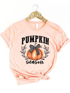 Collect yourself in the most fashionable way possible this season! Nothing says bring on fall-like fun graphic tees! Pair this with your favorite high waisted jeans and booties for an elevated comfy look! Sizing: Small 4/6 Medium 8/10 Large 12/14 XL 14/16 All of our graphics are DTF which means they are printed onto a film using a specialist printer. Then the prints are directly transferred onto the tee via a heat press. Trendy Graphic Print T-shirt For Fall, Trendy Fall Letter Print T-shirt, Trendy Letter Print T-shirt For Fall, Cute Fall T-shirt With Relaxed Fit, Cute Relaxed Fit T-shirt For Fall, Fun Graphic Tees, Pumpkin Graphic, Pumpkin Season, Pumpkin Seasoning