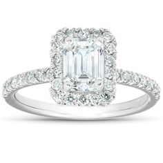 an emerald cut diamond ring with diamonds around it