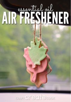 an air freshener hanging from a car's dashboard with the words essential oil on it