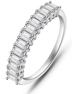 a white gold ring with baguetts on the side