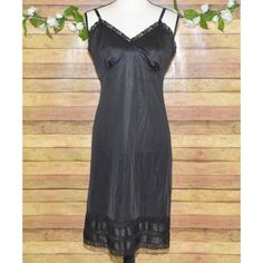 Classic vintage LADY MANHATTAN full slip dress in black. Silky nylon, size 36 M, snip-to-fit length, adorned with delicate lace trim. Ideal for any woman who appreciates timeless style. * Vintage LADY MANHATTAN slip dress * Black, silky nylon material * Size 36 M * Snip-to-fit length (3 Length Options Just Cut Off What You Don't Need)   * Delicate lace trim Location: Section 2 Please SEE measurements of the clothing items to insure fit! Measurements are in the last photo. To check measurements, Fitted Black Slip Dress With Lace Trim, Fitted Black Knee-length Slip Dress, Fitted Knee-length Black Slip Dress, Black Fitted Lined Slip Dress, Fitted Black Lined Slip Dress, Black Sheer Slip Dress, Black Lined Slip Dress For Night Out, Slip Dress Black, Vintage Lady