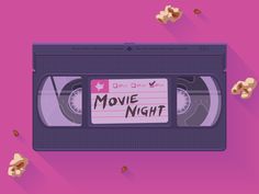 an old vhs tape with the words movie night written on it and popcorn scattered around