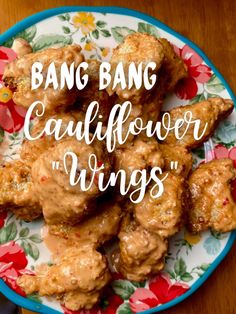 a plate full of food with the words bang bang cauliflower wings on it