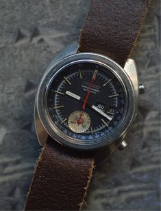 A legendary Seiko model, worn by Bruce Lee at the time that earned the watch its nickname.  This 1966 model is the first Chronograph in watchmaking history.  Everything is functional, with the chrono hand returning perfectly to zero.  Calibre 6139-6012 appreciated by connoisseurs and amateurs alike.  Brown leather NATO strap.  Case size excluding crown: 40mm x 43mm. Seiko Chronograph, Gift Ideas Birthday, Nato Strap, Vintage Watches For Men, Wrist Wear, Jewellery Ideas, Ideas Birthday, Bruce Lee, Wristwatch Men