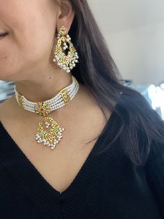 Traditional Punjabi/Hyderabadi/Pakistani/Indian/desi statement jadau choker set with meduim side earrings. The pendant is strung with the pearls with the sides and with the side tukdis. The set is complete with the pearls. The back of the necklace has dori to make it fit right around the neck. Inspired by traditional heritage Jewlery. Party Chandbali Meenakari Choker, Traditional White Meenakari Choker, Bollywood Chandbali Choker With Zari Work, Festive White Meenakari Choker, Festive Meenakari Choker Sets, White Meenakari Bollywood Choker, White Bollywood Meenakari Choker, Bollywood Style White Meenakari Choker, Bollywood Meenakari Choker Jewelry Set