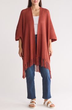 Love to layer this throw-on-and-go ruana that features an open knit design. 42" x 30" Open front Three-quarter sleeves Hand wash, dry flat Imported Model stats: 5'10", 32" bust, 25" waist, 36" hip. Model is wearing size OS. Fall Woven Shawl Poncho, Fall Layering Shawl Poncho, Knit Fabrication Shawl For Fall, Knitted Shawl Cape For Fall, Fall Knitted Shawl Cape, One Size Knit Shawl For Fall, Knit Shawl For Fall, Knit Shawl For Fall, One Size, Fall Knit Shawl One Size