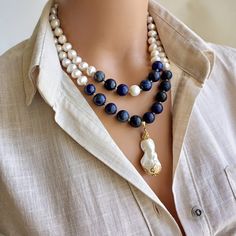 A timeless accessory that embodies natural beauty, the elegant Pearl and Lapis Lazuli Necklace combines lustrous freshwater pearls, known for their lustrous and iridescent appeal for women, with the deep blue appeal of real Lapis Lazuli natural stones. Handmade with love and attention to detail, this stunning necklace exudes a sense of opulence and elegance. MATERIALS: Freshwater pearls: These stunning pearls are prized for their pure brilliance and attractive shine, making each bead unique in i Designer Pearl Necklace, Handmade Wedding Gifts, Pearl Charm Necklace, Natural Stone Necklace, Lapis Lazuli Necklace, Natural Stones Necklace, Accessories Wedding, Women Necklace, Necklace Charm