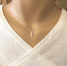 "Dainty, Sterling silver cross necklace, tiny and classic in style and perfect for everyday. Dainty cross pendant is just about 1/2\" long and on a sterling silver chain and small lobster clasp. *Please see all photos and read description. ♦ Tiny cross is just about 1/2\" long. Very dainty! PHOTO 3 shows how it looks on different sized adult customers. ♦Sterling silver, cable style chain with spring ring clasp. ♦All customer photos in photo block 3 of this listing are showing this necklace on a Cross Necklace Simple, Dainty Jewelry Necklace, Dainty Cross Necklace, Silver Cross Necklace, Sterling Silver Cross Necklace, Heart Choker, Hippie Necklace, Valentines Necklace, Cross Jewelry