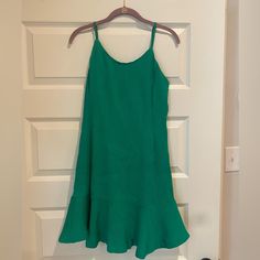 Never Wore Green Mini Dress Chic Green Sleeveless Dress For Brunch, Green Sleeveless Sundress For Brunch, Green Sleeveless Dress With Ruffle Hem For Summer, Green Mini Dress With Ruffle Hem For Day Out, Green Sundress With Ruffle Hem, Green Summer Mini Dress For Daytime, Green Sleeveless Mini Dress For Daytime, Green Sundress Mini Dress For Daytime, Green Sleeveless Daytime Dress