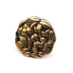 a gold ring with flowers on it