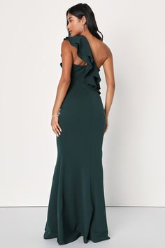 A chic-meets-elegant look is easy to achieve in the Lulus Grand Beauty Emerald Ruffled One-Shoulder Mermaid Maxi Dress! Stretchy, medium-weight crepe knit shapes this stylish gown with a tiered, ruffled one-shoulder sleeve that creates an asymmetrical neckline then carries into the darted bodice. High, fitted waist flows into a figure-flaunting maxi skirt finished with a flaring, mermaid hem. Hidden side zipper/clasp. Fit: This garment fits true to size. Length: Floor length. Size medium measure Elegant Green Mermaid Bridesmaid Dress, Elegant Green Bridesmaid Mermaid Dress, Elegant One Shoulder Bridesmaid Dress With Ruffles, Elegant One-shoulder Bridesmaid Dress With Ruffles, Elegant Green One-shoulder Dress For Date Night, Elegant Bridesmaid Maxi Dress With Mermaid Hem, Elegant Green One-shoulder Dress For Formal Occasions, Mermaid Maxi Dress, Stylish Gown