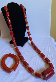 African Nigeria Coral Glass Long beads for men, unisex coral beads, Groom beads for wedding. Yoruba/Igbo/Igbo/Edo/Benin wedding coral glass bead. Men's jewelry. African necklace for men. Coral beads. For bride and groom.  2 piece includes 1 necklace and 1 bangle  Materials: Coral glass beads Mostly used - Traditional Wedding/marriage, Engagement, Baby Dedication, formal events. Contact for personalized orders  Kindly allow a difference of the picture/pattern of your item(s) between the real-life image and the photographic image on the website. No refund/no return /no exchange Benin Wedding, Glass For Men, Beads For Men, Wedding Coral, Red Beaded Necklaces, Coral Beads Necklace, Baby Dedication, African Necklace, African Jewelry