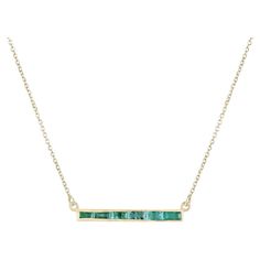 This stunning 14k gold bar necklace showcases four exquisite baguette-cut natural emeralds, boasting a medium green hue, semi-transparent clarity, and captivating luster, totaling 0.90 carats. The emeralds are expertly bezel-set east to west along the bar, adding a touch of elegance to the 18-inch long chain. Setting Style: Bezel Setting Material: 14K Gold Setting Weight: 1.5 Grams Main Stone: Emerald Shape: Baguette Cut Weight: 0.90-Carats (Total) Dimensions: 3.45mm x 2.34mm Clarity: Semi-Trans Emerald Bead, Gold Bar Necklace, Stylish Necklace, Solitaire Necklaces, Emerald Necklace, Bluish Green, Modern Necklaces, Emerald Stone, Baguette Cut