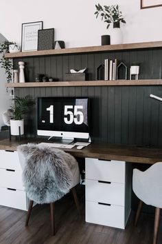 a desk with a computer on top of it