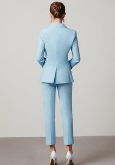 Blue Tailored V-Neck Pantsuit Set Exude effortless sophistication with this timelessly elegant suit. Crafted from a light baby blue fabric, our Blue Tailored V-Neck Blazer Suit will elevate your professional wardrobe with its tailored fit. Experience the pleasure of impeccable craftsmanship and luxe fabric today with this must-have for any professional woman. Description: Peak lapels; front button blazer V-Neck, Long sleeves; Structured shoulders. Structured shoulders. Double button Straight leg Elegant Light Blue Bottoms For Work, Elegant Light Blue Formal Bottoms, Elegant Light Blue Blazer For Workwear, Elegant Light Blue Blazer For Work, Light Blue Notch Lapel Blazer For Office, Solid V-neck Blazer For Formal Occasions, Light Blue Notch Lapel Suit For Office, Light Blue Notch Lapel Suits For Work, Light Blue Notch Lapel Suits For Office