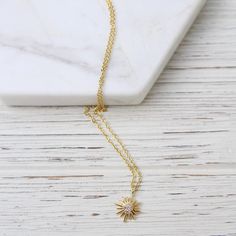 Sunburst with Center CZ Necklace 14k Gold Vermeil 17"-19" Adjustable Chain Designed in Canada by a Husband and Wife Team. Handmade in Thailand ﻿Shop more Tashi styles: HERE Dainty Starburst Yellow Gold Jewelry, Elegant Gold Starburst Necklace, Dainty Gold Starburst Necklace, Yellow Gold Starburst Necklace As Gift, Yellow Gold Starburst Necklace For Gift, Cz Necklace, Husband And Wife, Gold Vermeil, Thailand