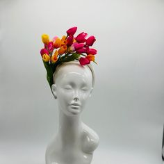 Handmade by Featured Milliner of The Kentucky Derby Museum 2023 & 2024! Spring has sprung! This is the perfect spring piece! Beautiful red, yellow and pink tulips with pops of green.  Attaches with headband.  Not taking customs this year--Derby 150 is going to be massive and mom life keeps me running! However, happy to suggest pieces that will coordinate with your outfit. If you don't love the way this attaches to your head--message me!  I can swtich *most* pieces to your preference. Clip, Headb Multicolor Spring Headband, Multicolor Headband For Spring, Red Fascinator For Spring Garden Party, Spring Multicolor Hat Fascinator, Multicolor Mini Hats For Spring Wedding, Yellow Spring Headband, Spring Multicolor Fascinator, Multicolor Mini Hat Headband For Spring, Elegant Multicolor Headpiece For Spring