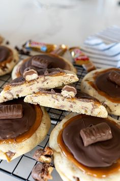 some cookies with chocolate and peanut butter on top