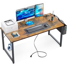 the computer desk has two monitors and a printer on it, along with an ipod