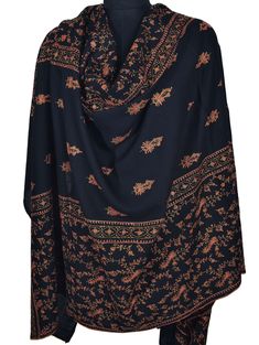 The deep jet-black color provides a striking backdrop for the elaborate Sozni needlework. Each motif is carefully stitched, with swirling teardrop shapes and delicate curls that make every one unique. The amount of detail in the embroidery speaks to the skill and artistry of the expert Kashmir artisan who made this shawl. Quality: Highest-Quality 100% Pure Pashmina Size: 40x80 inch or 100x200 cm Origin: Kashmir, INDIA.  Warm, Smooth, Super Soft, Symbol of Luxury This is our high grade Pashmina line. Retail Store Price: Over US$5000 Pashmina Kashmiri Embroidered Shawl or chain stitched shawls are a popular art of kashmir, crafted by skilled craftsman. Its a very rare contribution of art to the world by the people of Kashmir. These heirloom items are found in all corners of the earth, in ric Black Shawl With Intricate Embroidery In Traditional Drape, Black Pashmina Shawl With Intricate Embroidery, Black Intricate Embroidery Pashmina Shawl, Black Embroidered Pashmina Shawl, Black Shawl With Resham Embroidery In Traditional Drape, Black Resham Embroidery Shawl Traditional Drape, Black Resham Embroidered Shawl With Traditional Drape, Black Shawl For Eid With Traditional Drape, Black Pashmina Dupatta In Traditional Drape