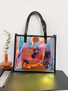 Bag For Love - Clear Holographic Shoulder Tote Bag - Women Tote Bags Product Description Color Multicolor Quantity 1 piece Type Shoulder Tote Bag Material PVC Composition 100% Polyvinyl Chloride Size Chart INCH CM Size Bag Width Bag Height Bag Length one-size 1.6/3.5 7.9/11 7.9/13 Size Bag Width Bag Height Bag Length one-size 4/9 20/28 20/33 Similar Products h2 { text-align: center; } .red-box { width: 100%; display: flex; flex-direction: row; flex-wrap: wrap; justify-content: center; } .red-box Trendy Square Bag With Letter Print, Square Shoulder Bag With Letter Print For Shopping, Plastic Shoulder Bag For Travel, Trendy Plastic Bag As Gift, Large Capacity Plastic Travel Bag, Trendy Plastic Tote Shoulder Bag, Trendy Plastic Travel Bags, Casual Rectangular Plastic Shoulder Bag, Portable Rectangular Plastic Bag