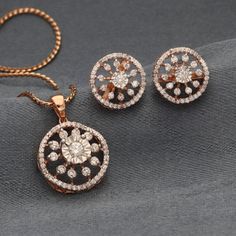 Description: Elevate your style with this exquisite round diamond pendant and earrings set without chain, meticulously crafted in 18K rose gold. This luxurious set features a stunning round pendant and matching earrings, each adorned with natural diamonds that exude brilliance and sophistication. Pendant Details: Material: 18K Rose Gold chain :  pendant and earring only (without chain) Main Stone: One Round Brilliant Natural Diamond (0.11 Carat, E-F Color, VVS Clarity) Accent Stones: 50 Natural Rose Gold Round Diamond Earrings With Halo Design, Rose Gold Round Halo Diamond Earrings, Rose Gold Diamond Jewelry With Halo Design, Fine Jewelry Sets With Matching Round Earrings, Rose Gold Round Diamond Earrings Fine Jewelry, Rose Gold Round Diamond Earrings With Brilliant Cut, Dazzling Rose Gold Round Diamond Earrings, Dazzling Rose Gold Diamond Earrings, Dazzling Rose Gold Round Pendant Jewelry