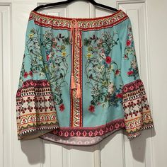 Umgee Aqua And Red Boho Top. Bell Sleeves. Flower And Butterfly Print. Very Roomy And Would Fit A Large. Never Worn. Such A Pretty Color Combo. Can Be Casual Or Dressy Red Boho Print Tops For Vacation, Summer Red Boho Print Top, Red Bohemian Top With Floral Print, Bohemian Red Tops With Floral Print, Red Bohemian Tops With Floral Print, Bohemian Red Floral Print Top, Summer Festival Blouse With Vibrant Print, Spring Vacation Peasant Top With Floral Print, Spring Bohemian Blouse With Vibrant Print