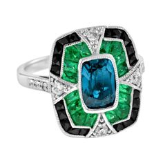 For Sale on 1stDibs - A striking and intriguing jewel, indeed. This bold and colorful Art Deco style ring highlights a gorgeous gleaming emerald cut London blue topaz framed Luxury Emerald-cut Sapphire Ring With 17 Jewels, Luxury Multi-stone Emerald Cut Emerald Ring, Art Deco Diamond Topaz Ring, Luxury Emerald Gemstones With Accent Stones, Luxury Emerald-cut Sapphire Ring With Gemstone Accents, Luxury Sapphire Ring With Emerald Cut And Gemstone Accents, Luxury Emerald Cut Sapphire Ring With Gemstone Accents, Elegant Octagon Multi-stone Ring, Luxury Green Topaz Gemstone Ring