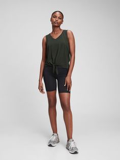 Breathable, lightweight performance jersey knit keeps you cool during your workout.  Moisture wicking helps keep your skin dry.  Four-way stretch allows freedom of movement while providing superior shape retention.  Tank straps.  V-neck.  Knot-front detail.