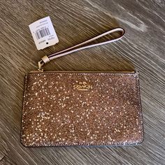 Beige Coach Wristlet Gold Glitter And Stars On Front Gold Hardware Card Slots On Inside Brand New Never Used Coach Gold Rectangular Wristlet, Coach Gold Wristlet For Everyday Use, Gold Coach Wristlet For Everyday, Gold Rectangular Coach Wristlet, Elegant Gold Coach Wristlet, Coach Evening Wristlet With Wrist Strap, Coach Gold Clutch Wristlet, Gold Coach Clutch Wristlet, Coach Clutch Wristlet For Evening