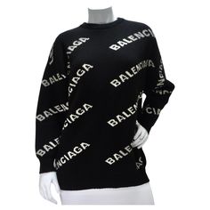 Introducing the Balenciaga Allover Logo Wool Sweater - a classic yet contemporary addition to your wardrobe that effortlessly combines comfort and style. This sweater embodies the essence of Balenciaga's timeless luxury. Crafted from premium black wool, this crewneck sweater exudes understated elegance and superior craftsmanship. Balenciaga's commitment to quality is evident in every stitch, ensuring that you not only look good but feel comfortable throughout the day. The white Balenciaga logos scattered throughout the sweater add a touch of modern flair to its classic design. These logos are tastefully integrated into the fabric, creating a subtle yet unmistakable statement of your fashion-forward sensibilities. This sweater is a versatile wardrobe staple that effortlessly transitions fro Designer Black Jacquard Knit Sweater, Designer Jacquard Knit Winter Sweater, Designer Jacquard Knit Sweater For Winter, Black Luxury Jacquard Knit Sweater, Luxury Long Sleeve Jacquard Knit Sweater, Luxury Jacquard Knit Sweater For Fall, Luxury Jacquard Knit Winter Top, Luxury Jacquard Knit Top For Winter, Luxury Black Winter Sweater