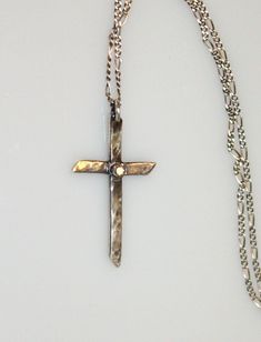 A hand-forged, hammered, sterling silver cross contrasts beautifully with a delicate, sparkling 2mm (I1) natural white diamond accent. Strung on an 18-inch sterling chain with a silver lobster claw clasp. Visit my necklace an pendant section for more handmade beauties: https://www.etsy.com/shop/MyFascinationStreet?section_id=16231287&ref=shopsection_leftnav_6 Visit my shop: www.etsy.com/shop/MyFascinationStreet Connect with me on... www.FascinationStreetDesigns.com Facebook: https://www.face Solitaire Necklace Diamond, Silver Diamond Cross Necklace, Diamond Necklace Silver, Necklace Diamond Pendant, Diamond Star Necklace, Diamond Cross Necklace, Silver Cross Necklace, Solitaire Necklace, Diamond Solitaire Necklace