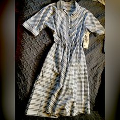 The Vintage Woman’s American Shirt Dress Is A Size 14 And Says Petite But Is Fairly Long As Was The Style Back Then. I Feel This Dress Would Fit As A Normal Length Nowadays Instead Of Being Long If Worn By Someone Taller. The Dress Is Brand New With Tags Still On. No Defects That I Found. Casual White Knee-length Vintage Dress, White Casual Vintage Dress For Daywear, Casual White Vintage Short Sleeve Dress, Casual White Vintage Dress With Short Sleeves, Casual White Short Sleeve Vintage Dress, Casual Knee-length Vintage Dress For Daywear, Spring Vintage Relaxed Fit Dress, Vintage Short Sleeve Relaxed Fit Dress, Vintage White Cotton Midi Dress