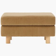 the footstool is made from wood and has a beige corded upholstered fabric