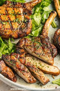 grilled pork chops and greens on a plate